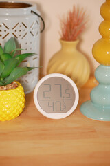Indoor temperature and humidity display in a cozy setting