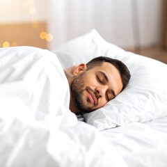 Man sleeping peacefully in a comfortable bed with white sheets.