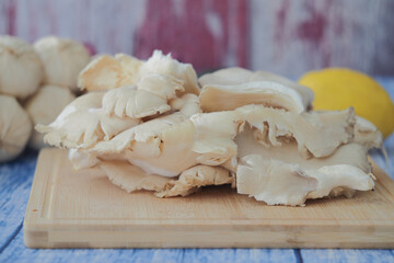 Fresh ginger and garlic on a wooden cutting board