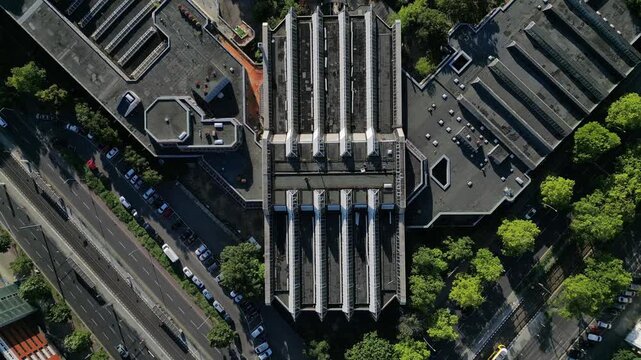 Sez and Volkspark Friedrichshain in Berlin, showcasing its lush greenery, a passing tram on a sunny day. speed ramp hyper motion time lapse Best aerial view flight vertical bird's eye view drone