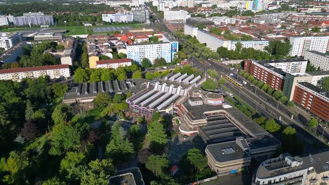 urban landscape of Berlin Friedrichshain, featuring the abandoned Sez a historical Gdr indoor swimming pool. Magic aerial view flight drone shot from above