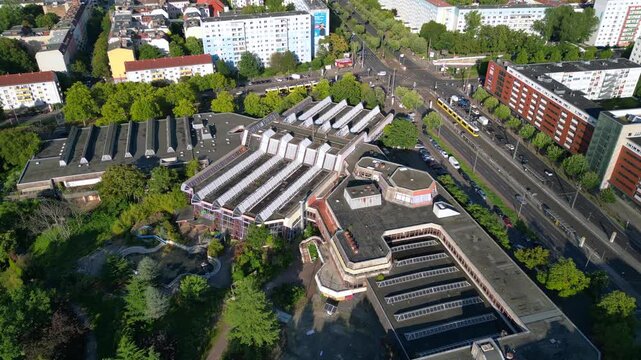 urban landscape of Berlin Friedrichshain, featuring the abandoned Sez a historical Gdr indoor swimming pool. Nice aerial view flight drone camera pointing down