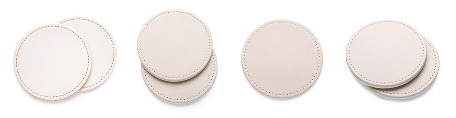 Set of leather drink coasters on white background