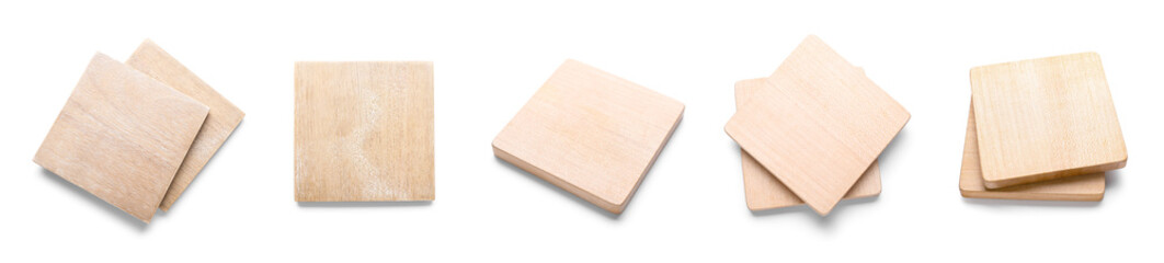 Set of wooden drink coasters on white background