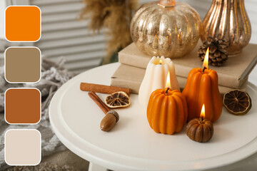 Burning candles in shape of pumpkins with autumn leaves and books on stool at home, closeup