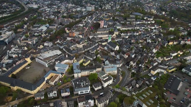 Aerial panorama view around the old town of the city Siegen in Germany on a sunny spring noon