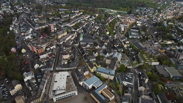 Aerial panorama view around the old town of the city Siegen in Germany on a sunny spring noon