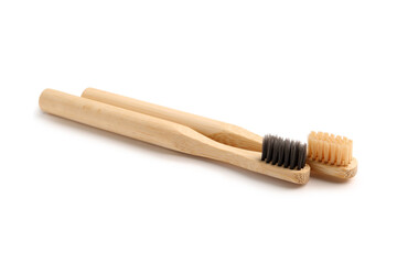 Bamboo tooth brushes on white background