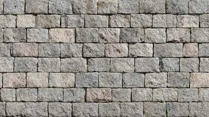 Fototapeta premium Structured cobblestone wall texture in square formation with subtle joints, clean finish for modern architectural or design rendering