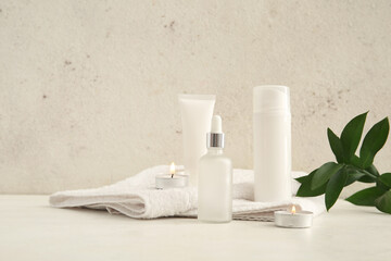 Set of spa supplies on white wooden background