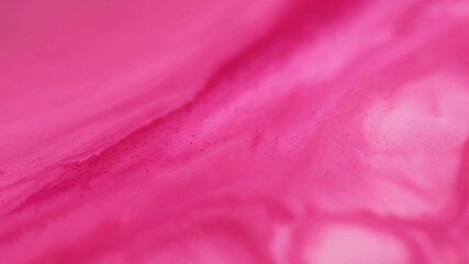 Ink water. Marble texture. Defocused pink color chemical liquid ripple fluid particles essence...