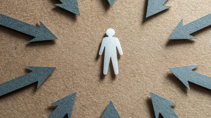 Paper figure standing alone surrounded by pointing arrows, exclusion metaphor