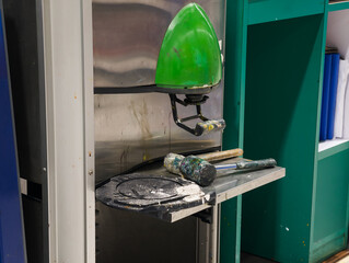 Rubber hammer on mixing paint machine