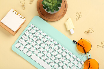 Modern computer keyboard with houseplant, sunglasses, notebook and flash drive on yellow background