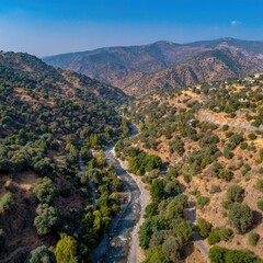 Aerial View Of Mountainous River Valley With Lush Vegetation