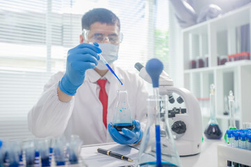 Fototapeta premium Scientists collaborating in laboratory, analyzing samples under microscope, conducting medical research and experiments for biotechnology, healthcare innovation, and scientific discovery. 