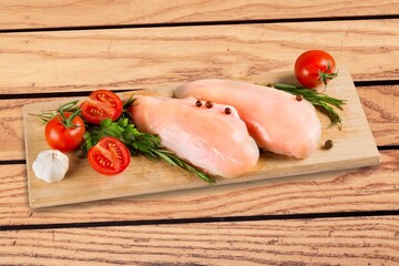 Raw fresh chicken breast on desk