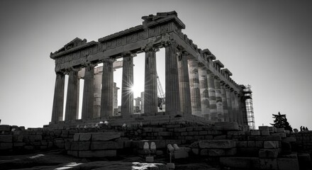 Obraz premium Sunlight shining through the ancient columns of the Parthenon temple on the Acropolis, a dramatic black and white perspective