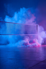 Volleyball Net with Vibrant Colorful Smoke in Blue and Pink Light
