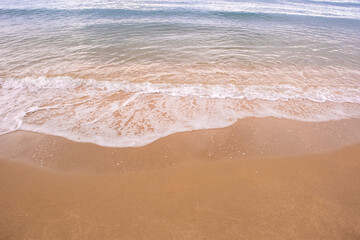 Nature of the ocean and blue sky Summer with sunshine, sandy beaches, clear blue waters sparkling against the blue sky. on an island with good ecology and environment Background for summer vacation