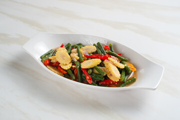 Homemade stir-fried long beans and baby corn. Perfect for recipes, articles or any cooking content.