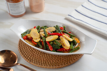 Homemade stir-fried long beans and baby corn. Perfect for recipes, articles or any cooking content.