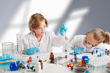 Kids at school learning science chemistry.