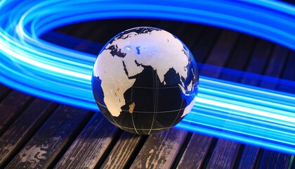 Glass globe centered on dark wood, encircled by bright blue light trails