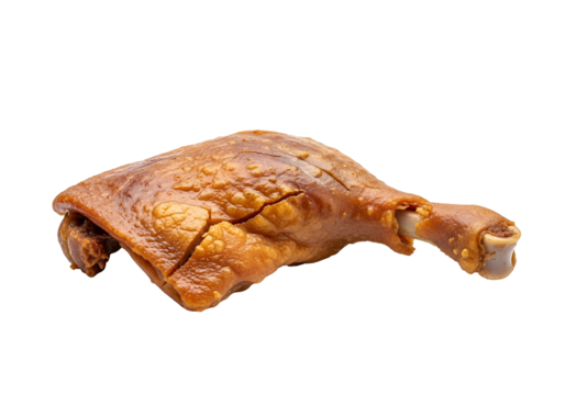 Roasted duck leg, showcasing crispy skin and rich brown hues, presented against a black background.