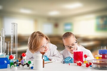 Kids at school learning science chemistry.