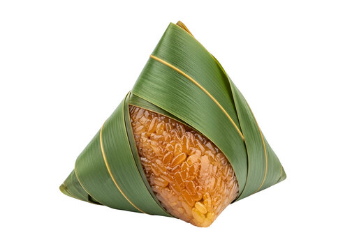 A triangular shaped rice dish, carefully wrapped in vibrant green leaves, creates a visually appealing presentation.
