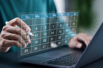 Agenda work schedule concept, business planning calendar, organize schedules and important dates. Businessman highlight appointment reminders and meeting agenda on the calendar.