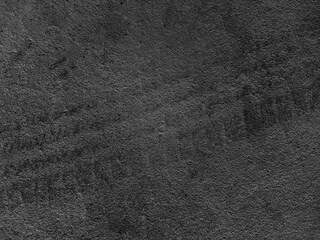 Close up black tire marks on cement floor.