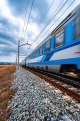 Fototapeta premium A high-speed train passing through countryside fields