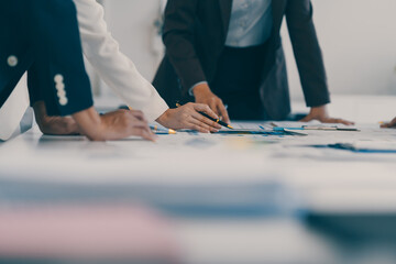 Business team analyzing financial data and discussing growth strategy during a productive office meeting