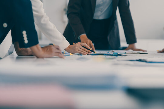 Business team analyzing financial data and discussing growth strategy during a productive office meeting