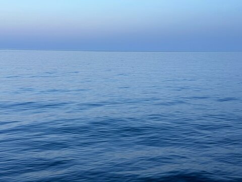 Ocean tranquil blue water at evening.