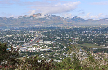 View of buildings, roads and a cloud-covered mountain from the Castle Hill lookout in Townsville, Queensland, Australia