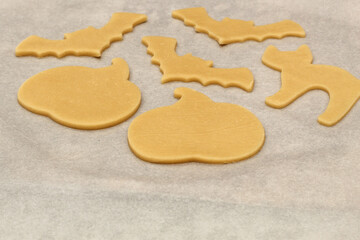 Uncooked Halloween Cookies on Parchment Paper