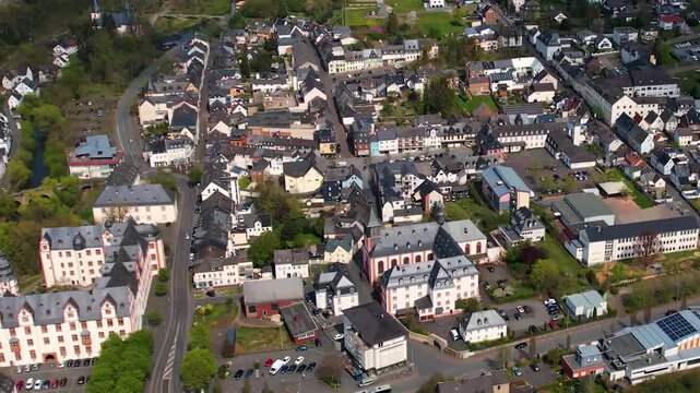 Aerial panoramic view around the old town and palace of the city Hadamar, Germany on a sunny spring morning