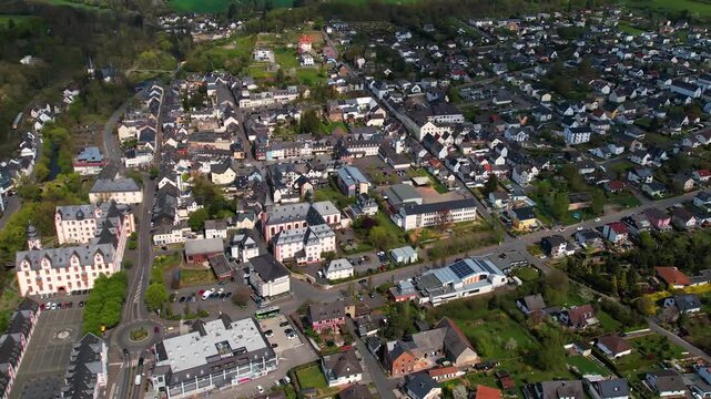 Aerial panoramic view around the old town and palace of the city Hadamar, Germany on a sunny spring morning