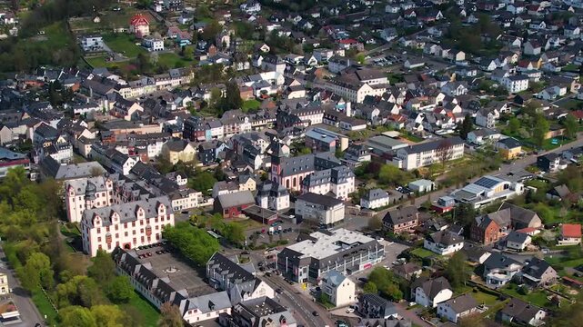 Aerial panoramic view around the old town and palace of the city Hadamar, Germany on a sunny spring morning