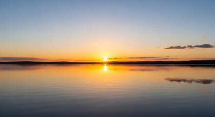 Serene Sunrise Over a Calm Lake.