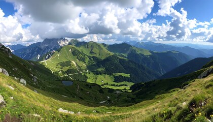 Obraz premium Panoramic mountain vista with lush valleys and rolling hills