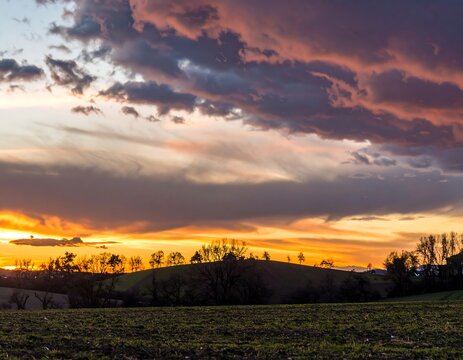 Dramatic sunset over a rolling landscape