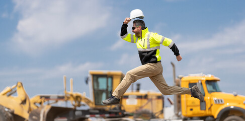 Excited construction builder. Worker jumping at heavy machines. Man engineer running to success. Builder man run fast to work. Engineer supervisor running outdoor. Supervisor jumping. Finish work