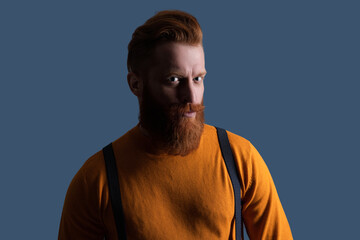 Fototapeta premium Male vintage style. Vintage brutality guy wear retro suspenders. Retro man in suspenders isolated on grey. Mature redhead man with hairstyle. Vintage male fashion style. Fashion portrait