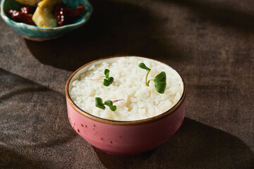 Boiled rice garnish in bright rustic lighting, closeup composition for menu backgrounds