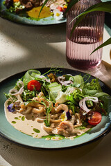 Warm squid salad in creamy sauce, bright natural light, overhead presentation