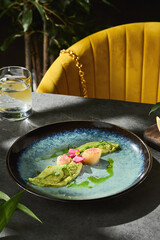 Seared scallops with broccoli puree, bright sunlit closeup, modern dining composition